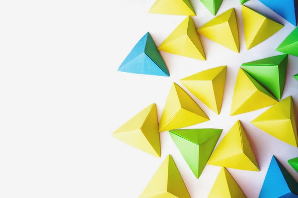 Origami pyramids background. — Stock Photo, Image