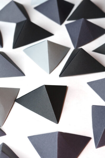 Monochrome black and gray tetrahedrons background.