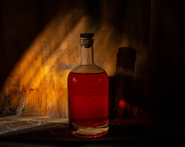 Bottle Filled Liquid Crimson Color Closed Cork Background Old Wooden — Stock Photo, Image