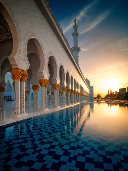 ABU DHABI, UAE - MAR 19, 2014: Sunset view at Sheikh Zayed Grand Mosque, Abu Dhabi, United Arab Emirates