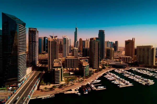 Amazing colorful dubai marina skyline with water canal and expensive yachts during sunny day, Dubai, United Arab Emirates. — Stock Photo, Image