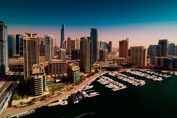 Amazing colorful dubai marina skyline with water canal and expensive yachts during sunny day, Dubai, United Arab Emirates. — Stock Photo, Image