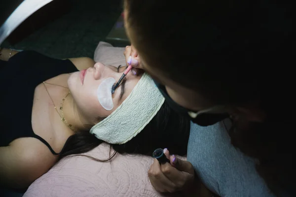 Young woman receiving natural eyelash lift treatment