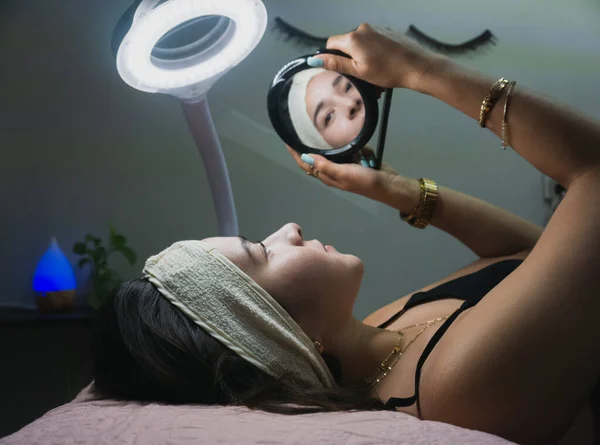 Young Woman Looks Mirror Receiving Facial Treatment — Stock Photo, Image