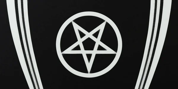Pentagram and lines on a black background. Magic symbol. Monochrome background