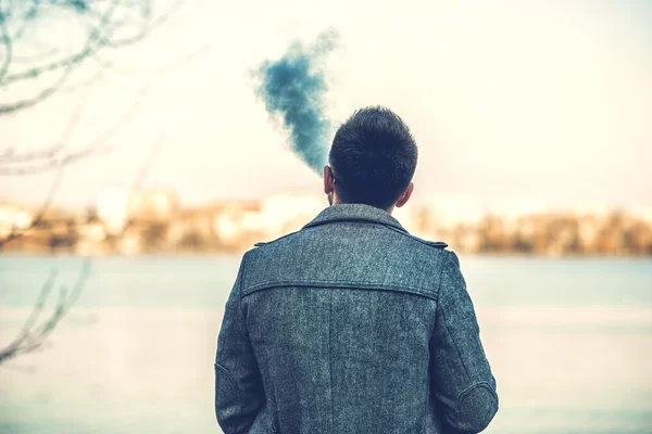 Man with beard vaping outdoor — Stock Photo, Image