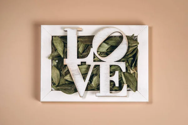 Creative Flat Lay Word Love Frame Soft Color Background — Fotografia de Stock