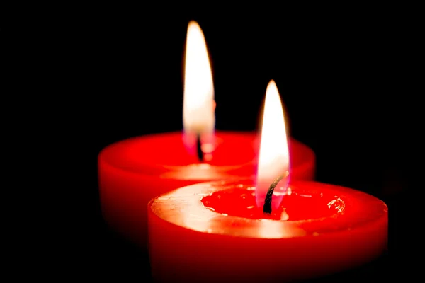 Closeup of burning candles on black background, christmas, holid — Stock Photo, Image