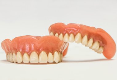 Dental dentures isolated on white clipart