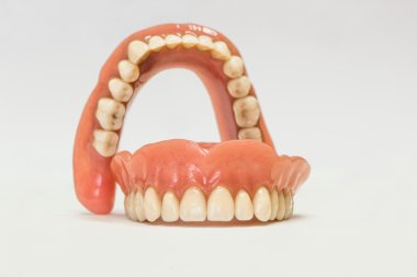 Dental dentures isolated on white clipart