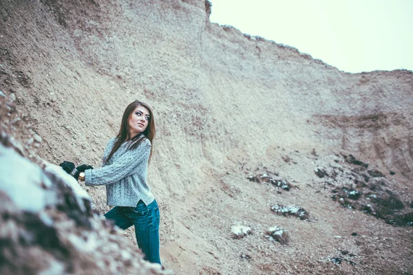 Pretty young woman outdoor in quarry with sand — Stock Photo, Image