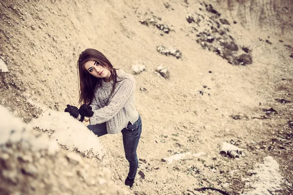 Pretty young woman outdoor in quarry with sand — Stock Photo, Image
