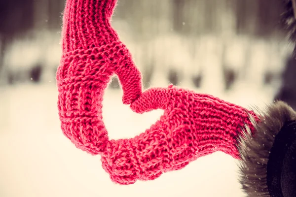 Heart shaped hands in the gloves outdoor — Stock Photo, Image