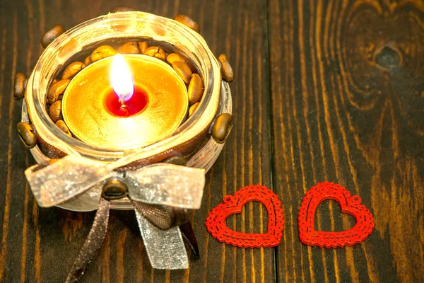 Decoration with red hearts and candle — Stock Photo, Image