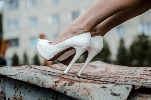 Girl in white high heels — Stock Photo, Image