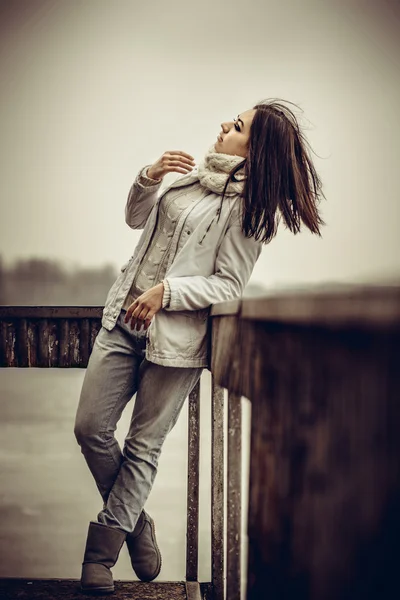 Pretty young girl outdoor on the old bridge — Stock Photo, Image