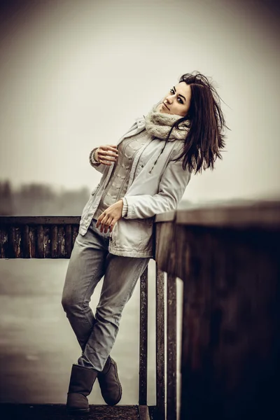 Pretty young girl outdoor on the old bridge — Stock Photo, Image