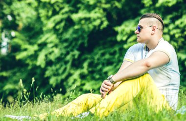 Pretty young man in sunglasses