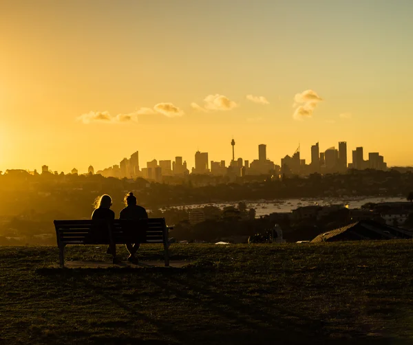 Watching the city at sunset — Stock Photo, Image