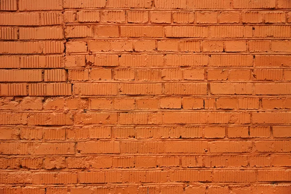 Фрагмент Цегляної Стіни Пофарбованої Помаранчевою Фарбою Справжніми Тріщинами Ятинками — стокове фото