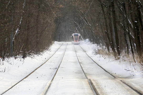 White tram in the Sokolniki winter park in Moscow