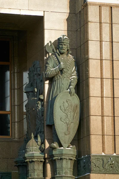 The figure of an ancient Russian warrior on the facade of the building of Vozdvizhenka Street in Moscow
