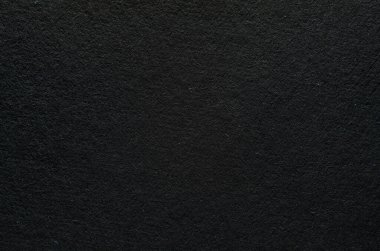 Lifli siyah kağıdın pürüzlü dokusu, makro fotoğrafçılık. Kağıt arkaplan üst görünümünü kapat