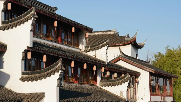 The old classical Chinese architectures with the black tiles roof and white wall designation