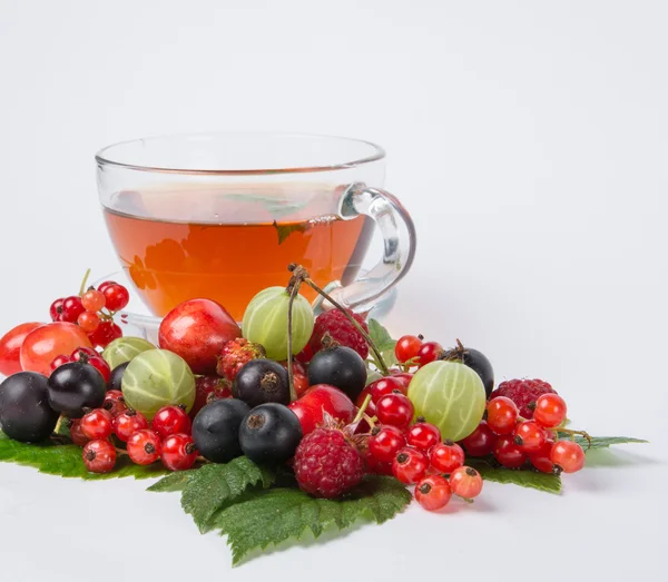 Sweet hot black tea with assorted berry — Stock Photo, Image