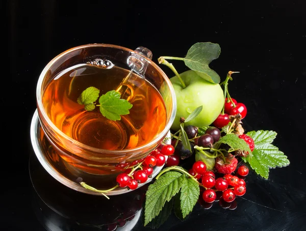 Berry cuts and tea on black background — Stock Photo, Image