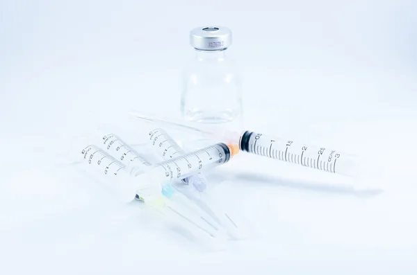 Medical ampoules and syringe — Stock Photo, Image