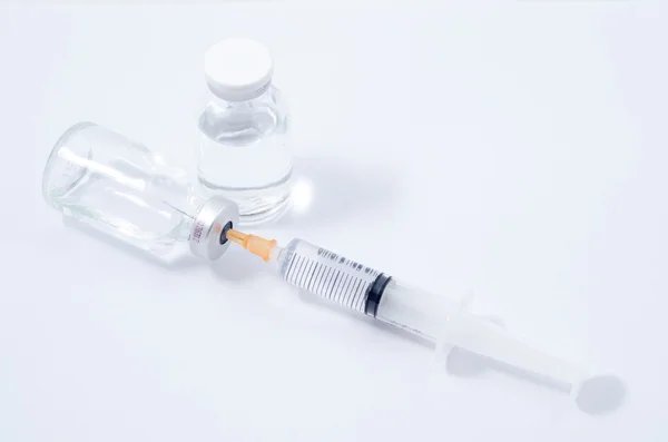 Medical ampoules and syringe — Stock Photo, Image