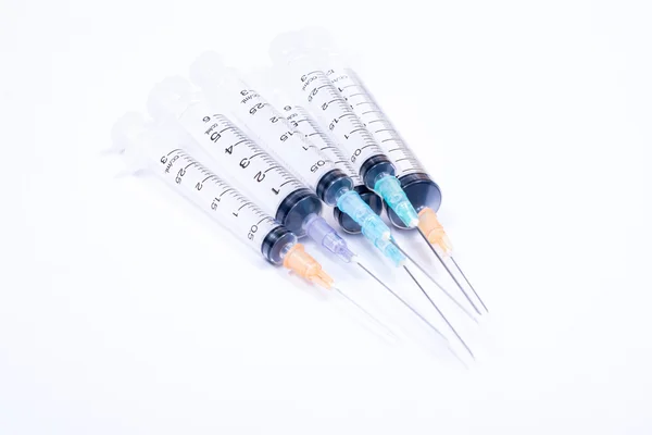 Syringe with droplet and medical on white background. — Stock Photo, Image