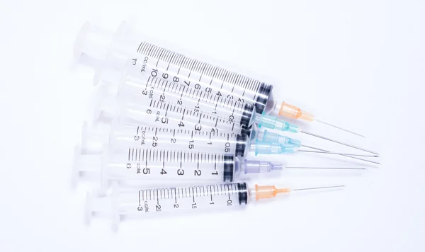 Syringe with droplet and medical on white background. — Stock Photo, Image