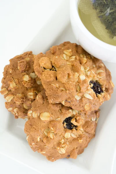 Oatmeal cookies and cup coffee on white background isolated. — Stock Photo, Image