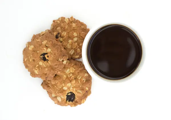 Oatmeal cookies and cup coffee on white background isolated. — Stock Photo, Image