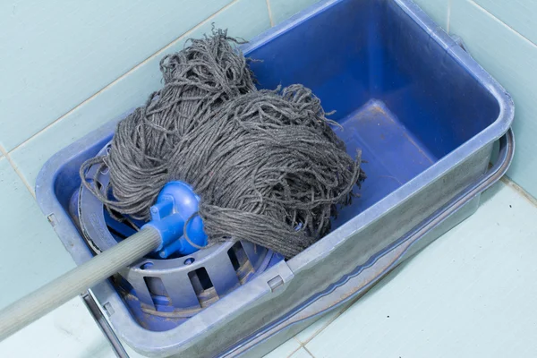 Blue bucket with cleaning mop — Stock Photo, Image