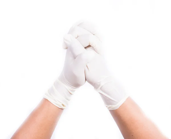 cerrahi eldiven ellerinde. Beyaz arka plan üzerinde izole