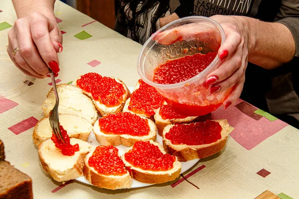 Woman Spreads Red Caviar Fork Chopped Baguette — Stock Photo, Image