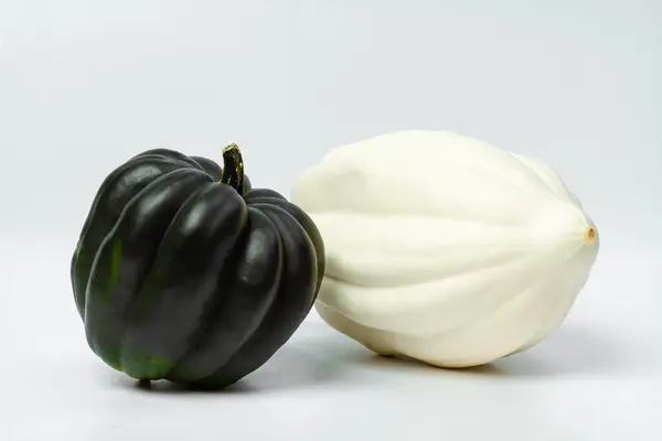 Two Pumpkins White Dark Green Light Background Food Photo — Stock Photo, Image