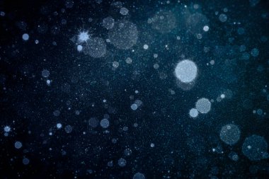 Particles of light and dust on dark blue background stock photo