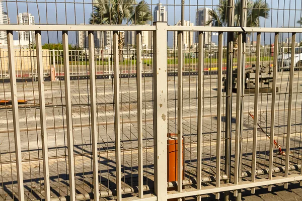 Street metal fence during construction. Metal barrier.