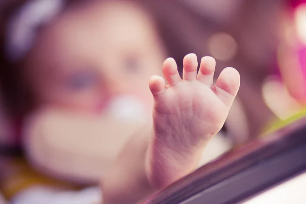 Child is lie in a carriage. — Stock Photo, Image