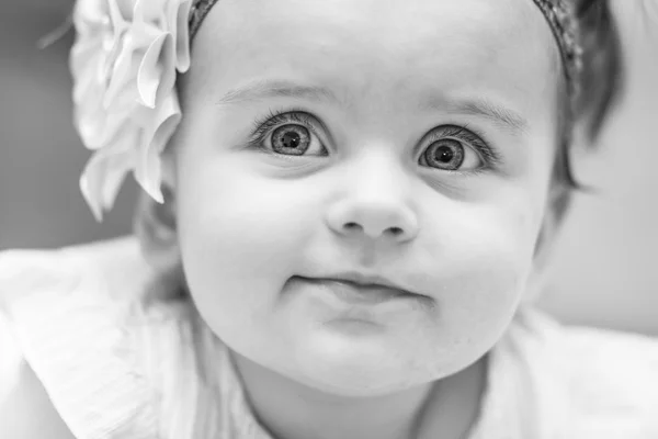 Small child wearing a dress and a sling. portrait. — Stock Photo, Image