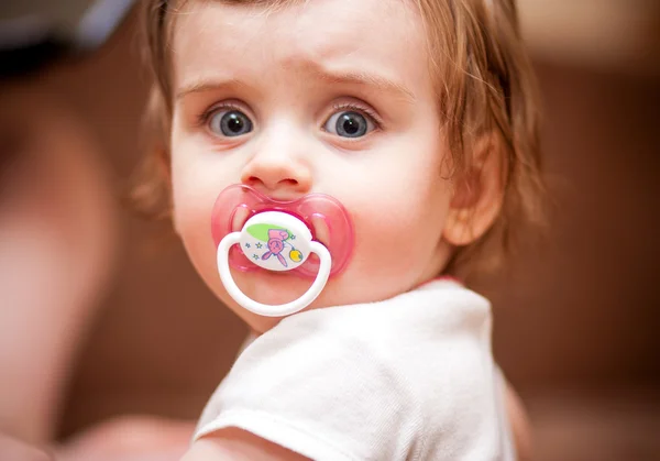 Little girl with a pacifier. portrait — Stock Photo, Image