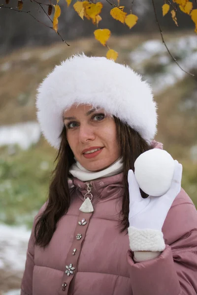 Girl Winter Clothes Walk Park Holds Snowball His Hands Yellowed — Stock Photo, Image