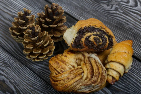 Cinnamon Poppy Seed Buns Rich Pastries Nearby Pine Cones Close — Stock Photo, Image