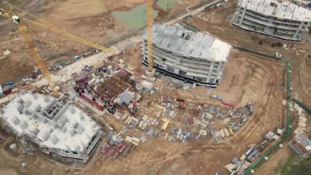 Flight over the construction site. Construction of multi-storey buildings. Modern urban development. Aerial videoography.. — Stock Video