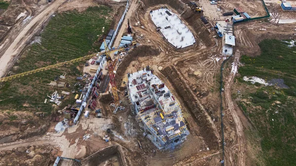 Modern urban development. Construction site with multi-storey buildings under construction. Construction work is underway. Aerial photography.