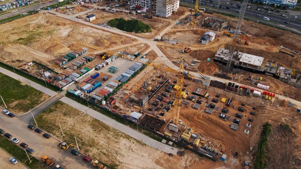 Aerial view of the new urban development. New houses are being built. The cranes are visible.